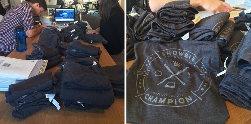 Showbie staff stuffing envelopes with Champions T-shirts